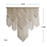 tapisserie macramé boho chic motifs géométriques franges beige clair tige bois crochets métalliques