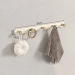porte sacs mural moderne fixations vis texture bois naturel blanc minimaliste