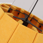 Suspension lumineuse moderne plissée jaune fixée chaînes salon chambre