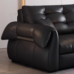 canapé lit noir simili cuir moderne coussin décoratif table basse tapis couverture