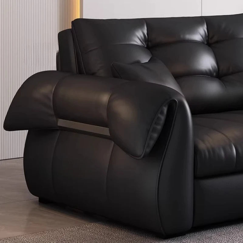 canapé lit noir simili cuir moderne coussin décoratif table basse tapis couverture