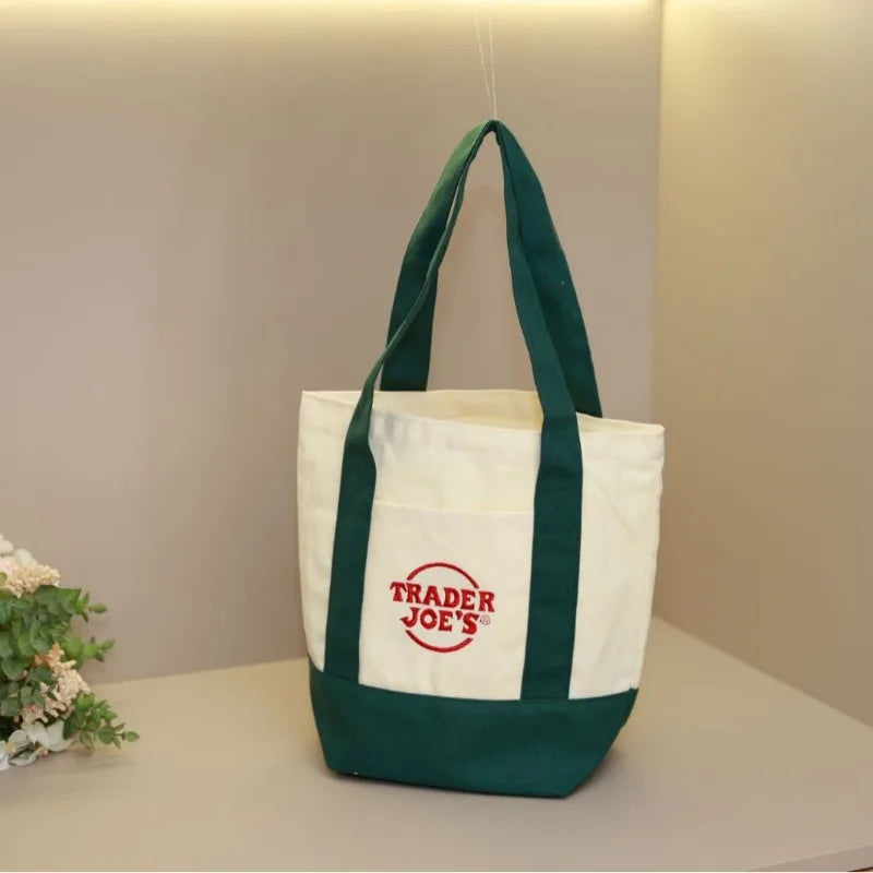 sac main toile verte rouge blanc jaune trader joes logo poignées simple pratique
