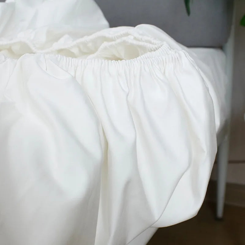 draps lit blancs satinés king size boutonnés complet moderne ecofriendly