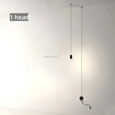 suspension lumineuse moderne fer noir structure géométrique interrupteur bouton éclairage intérieur minimaliste