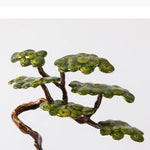 sculpture d'art moderne bronze feuilles vert texture métallique base carrée noire minimaliste