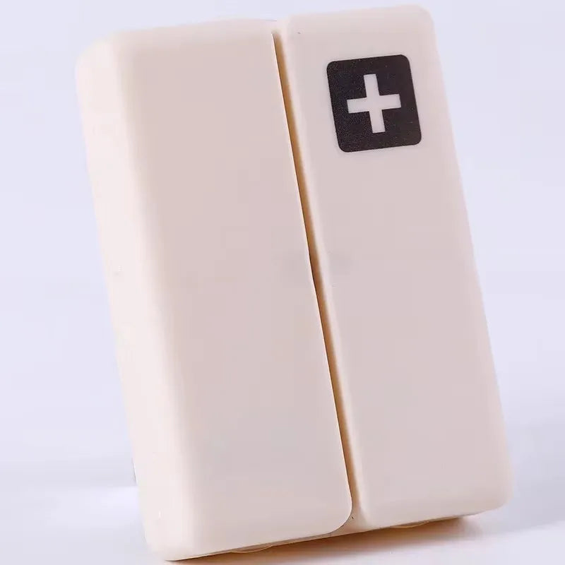 boîte pilules hebdomadaire compartiments couleurs pastel croix blanche moderne pratique