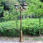 lampadaire extérieur or noir verre translucide vintage élégant détails sculptés deux lampes abat jours