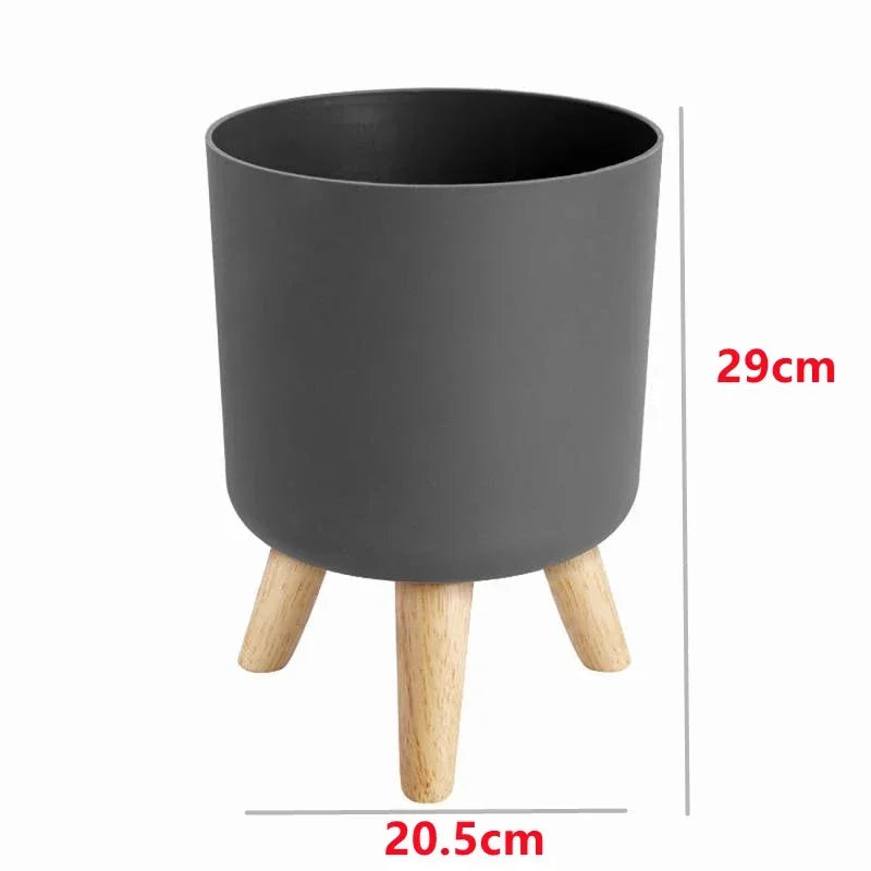 Pot de fleur sur pied dans une chambre avec décoration épurée