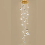 suspension lumineuse moderne transparente dorée facettes géométriques élégantes multiples lampes
