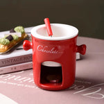fondue chocolat moderne tasses lait rouge noir blanc cuillère bougie