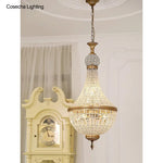 suspension lumineuse cristal dorée élégante classique brillants transparents chambre salon