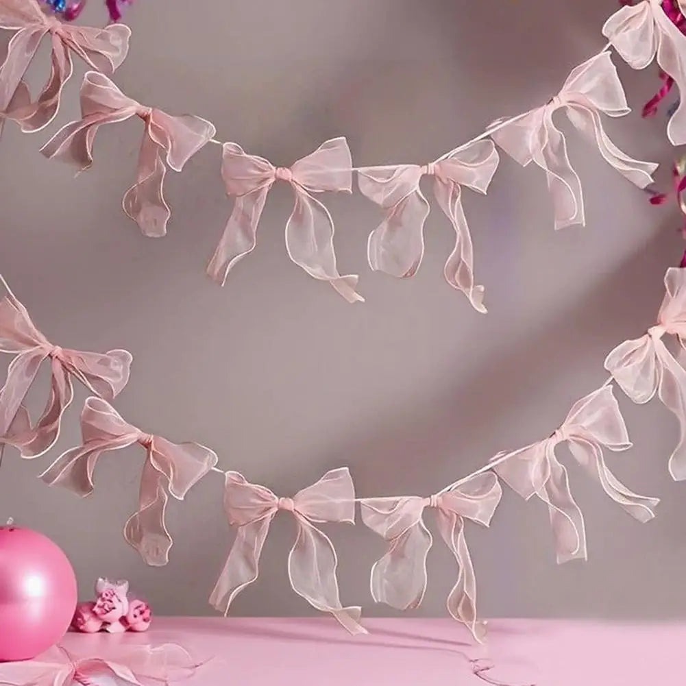 décoration festive guirlande nœuds rose tissu texturé semi transparent mariage anniversaire enfant baby shower