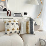 taies d'oreiller bohèmes géométriques texturées coussins décoratifs modernes pompons beige gris doré blanc