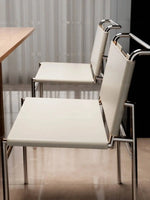 chaise moderne cuir couleur orange noir blanc tringles chromées contemporaine