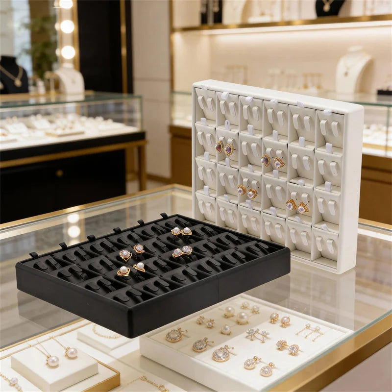 boîte bijoux cuir noir blanc plateau rangement bague boucle d'oreille organisation modernescrição