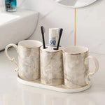 ensemble vaisselle salle bain marbre blanc gris or classique tasses poignées dorées porte brosse