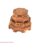 support vase bois artisanal marron clair texture naturelle découpes géométriques traditionnel métalliques