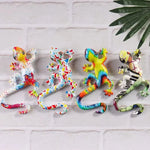 Sculpture résine lézard multicolore motifs abstraits art contemporain décoration murale crochets inclusion