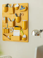 panneau rangement mural clips couleur beige vert blanc rouge noir moderne salon