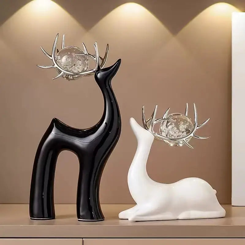 décorations modernes deux cerfs noirs blancs sphères verre transparentes bulles