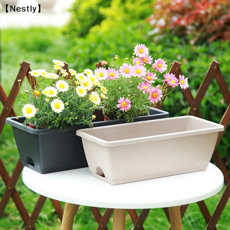 pots fleurs modernes fonctionnels couleurs vert orange gris beige bleu poignée métallique auto absorbants