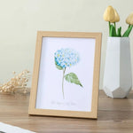 cadre photo bois moderne floral blanc noir cactus palmier fleurs bleues minimaliste mur table