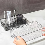 bac rangement transparent texture ondulée moderne salle bain contenant parfum lotion brosse dents crème