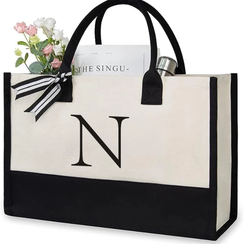 sac main toile lettre imprimée blanc noir rubans classique poignées intérieur noir zippé capacitaire