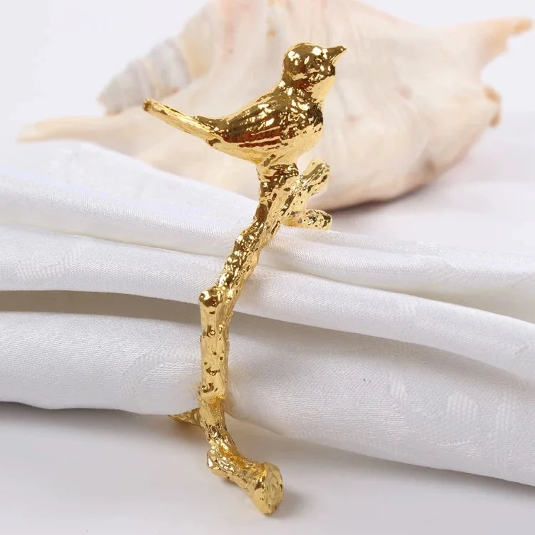 porte serviette moderne or oiseau stylisé argent branche naturelle minimaliste