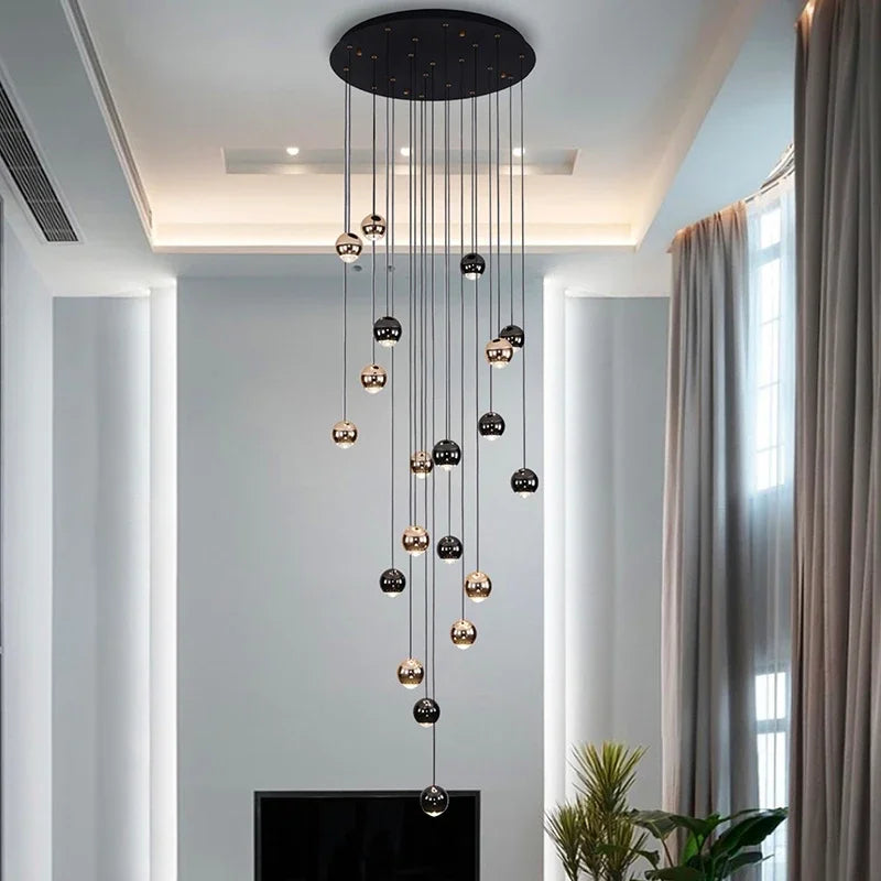 suspension lumineuse contemporaine noir doré sphères métalliques brillantes éclairage intérieur maison
