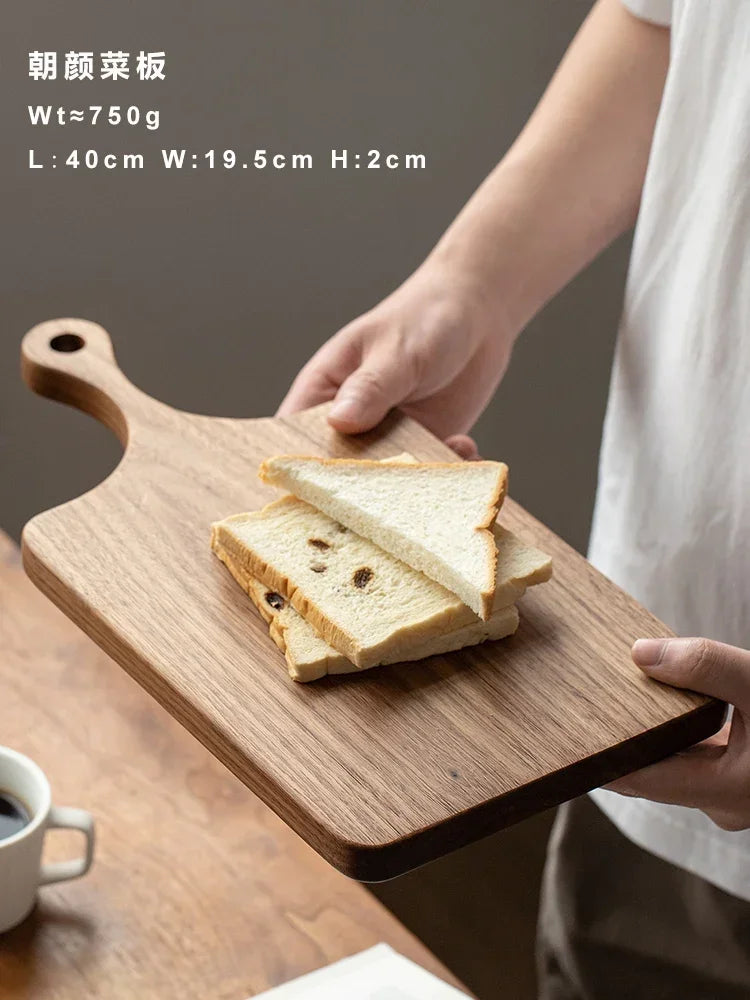 planches découper bois massif noyer marron foncé moderne rectangle poignée anneaux cuir cuisine restaurant