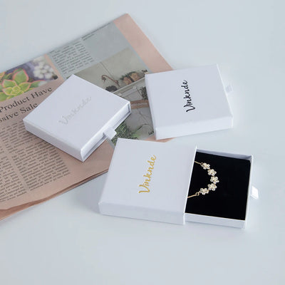Boîte à bijoux cadeau blanche avec tiroir coulissant et éponge noire