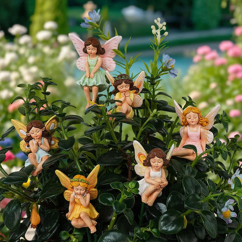 statues fées miniatures résine vert rose jaune robes colorées ailes translucides fantaisie decoration exterieure