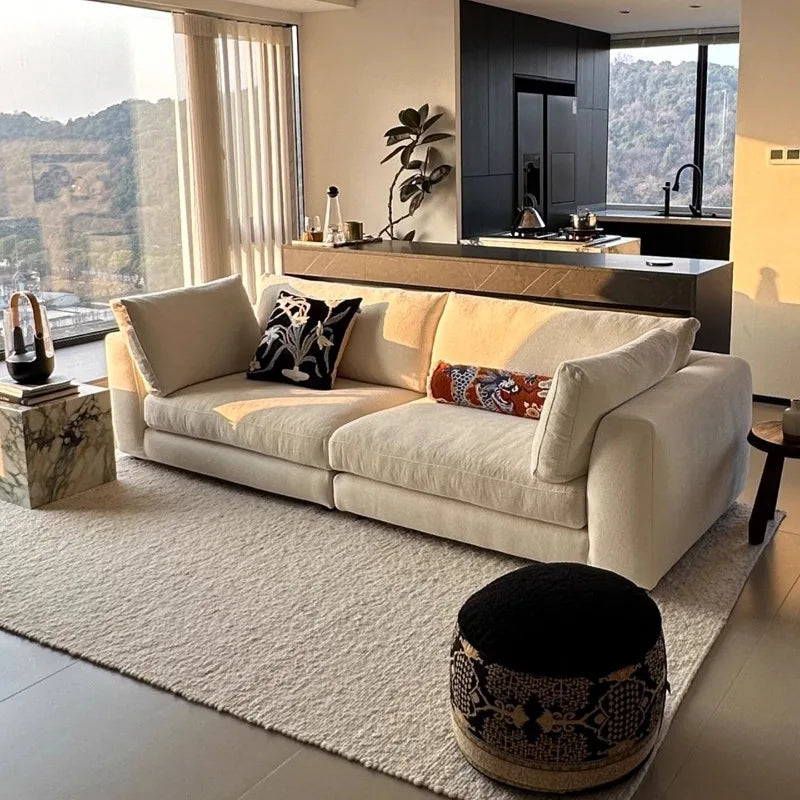 canapé moderne lin couleur beige clair forme bois minimaliste pieds ronds coussins
