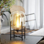 lampe sol moderne transparente ampoule filament noir gris fumé led verre minimaliste
