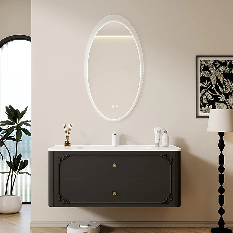 meuble salle bain noir blanc tiroirs vasque ornements dorés classique fixations murales accessoires cosmétiques