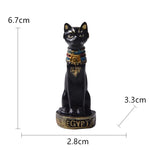 statuette égyptienne ancienne chat ornements hiéroglyphes noir blanc doré