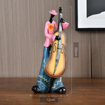 statues musiciens saxophone trompette ethniques motifs floraux bleu marron orange gris