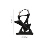 statue musicien moderne abstraite saxophone guitare noire décoration intérieure couple instrumental résine opaque base