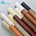 Papier peint adhésif PVC motif bois sur un meuble vintage