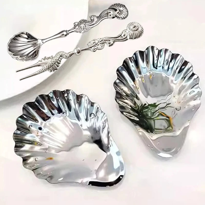 assiette coquille nacre argentée caviar bougie décoration table élégante cheese dessert snack fruit plate