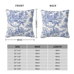 Housse de coussin bleu marine placée sur un canapé gris dans un salon élégant