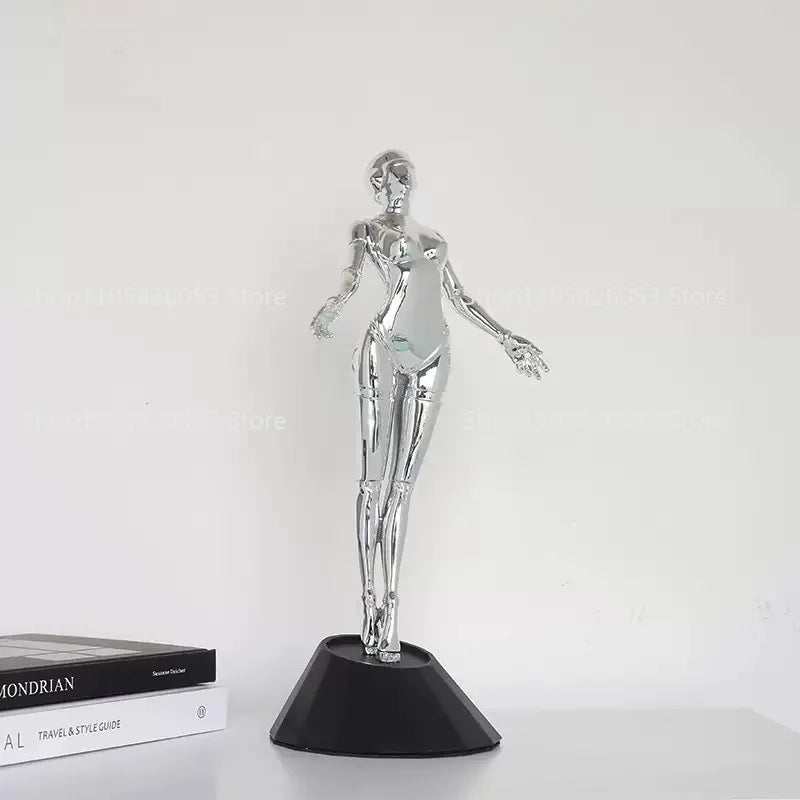 figurine humaine moderne argentée table chaises vases livres decoration intérieure robotique