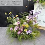 décoration murale naturelle composition florale variée couleurs vives rustique bienvenue mariage