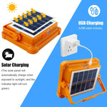 lampe solaire portable orange moderne étanche ip66 poignée articulée panneau solaire usb