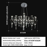 lustre moderne or cristaux transparents branches stylisées salon chambre principale