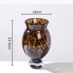 vases modernes translucides opaques motifs tourbillonnaires branches fleurs artificielles marron orange beige