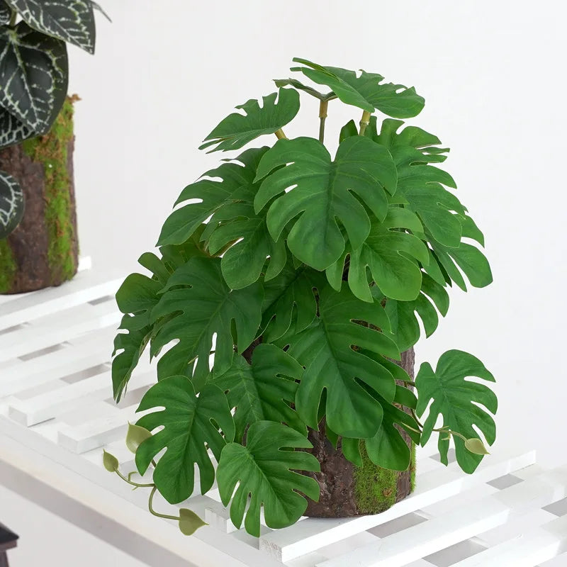 plantes artificielles feuilles vertes rouges noires modernes décoration extérieure mariage centro commercial exposées