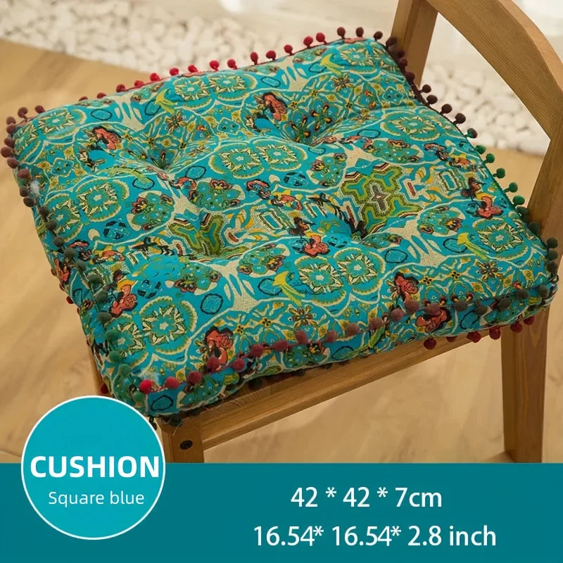 coussin carré bleu orange motif floral pompons boho chic décoration salon sol canapé