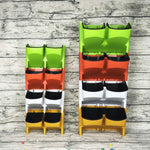 Système jardinage vertical moderne pots différentes tailles plantes fleurs mur orange vert jaune